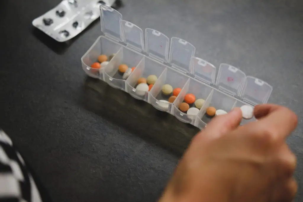 Nursing services and medication management. Organizing a pill case.
